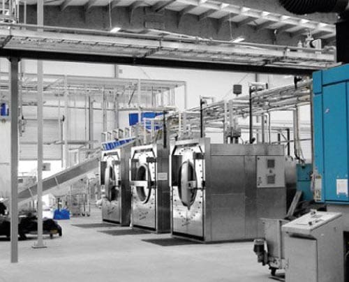 Mat-Washing-Depot Washroom laundry services; shown by a industrial washing set-up