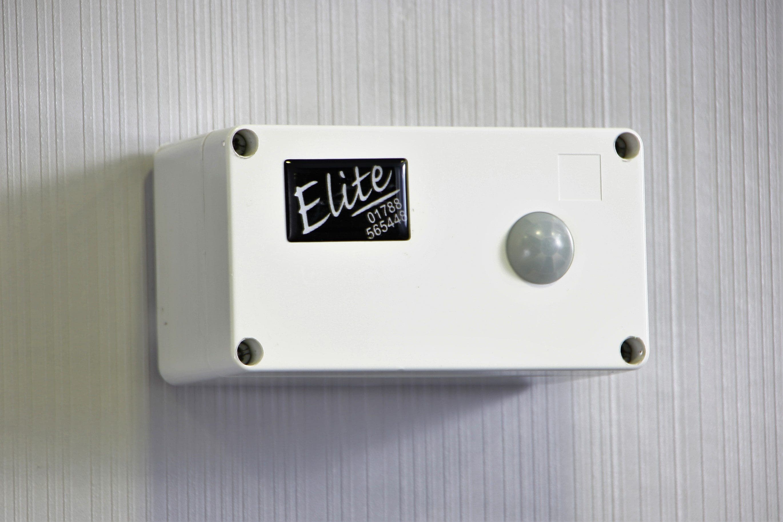 AL6I1069 (2) Urinal water savers - Sensaflush Water Management System sensor on a wall