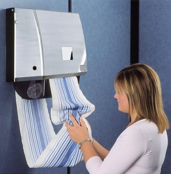 Linen roller towel dispenser being used by a lady